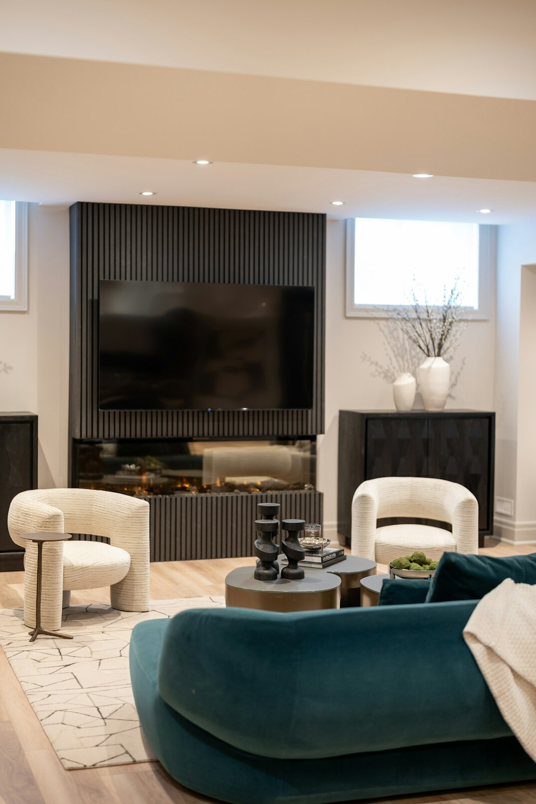Elegant retro living room in a celebrity villa with velvet armchairs and a marble fireplace