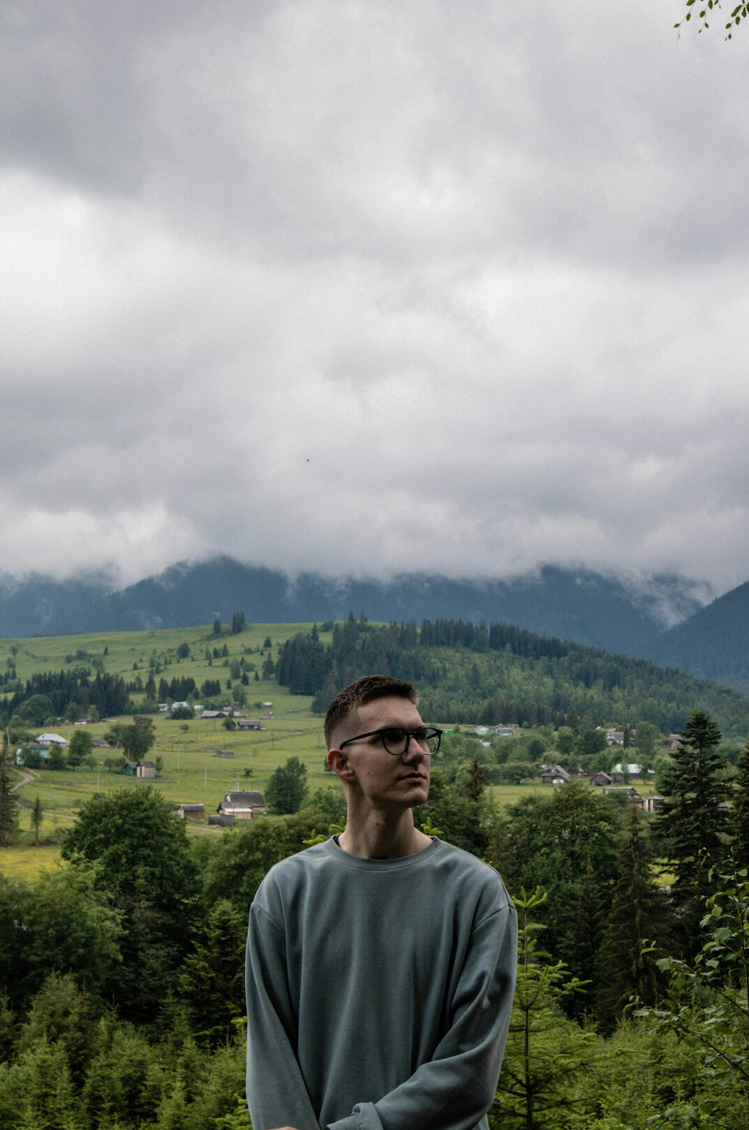Portrait of a Swiss male chief editor wearing glasses in an office
